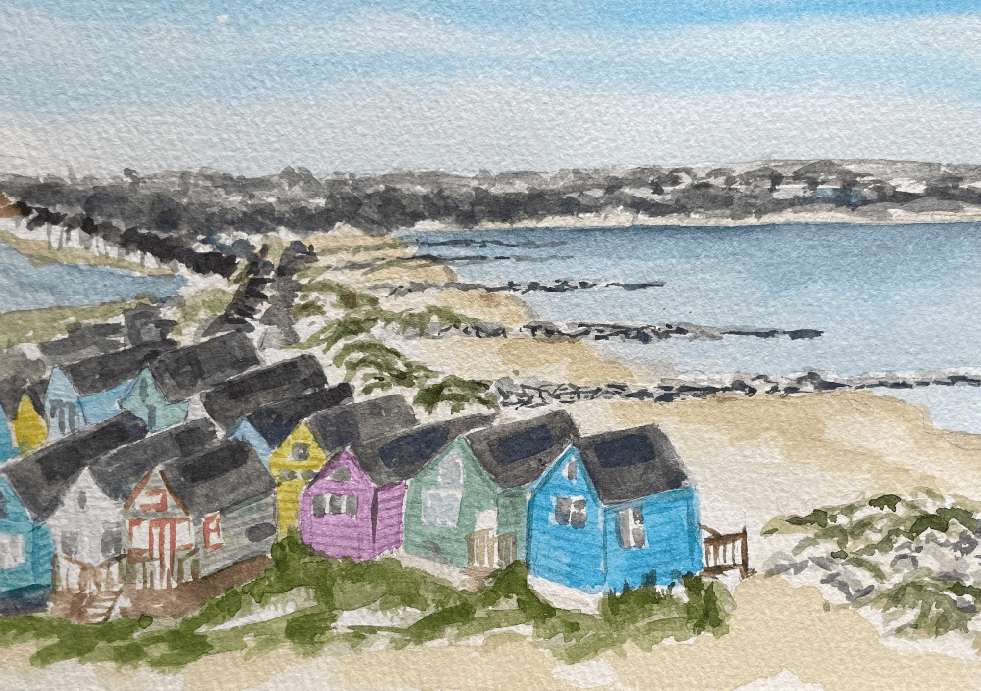 Watercolour coastal village scene with colourful beach huts and a bay