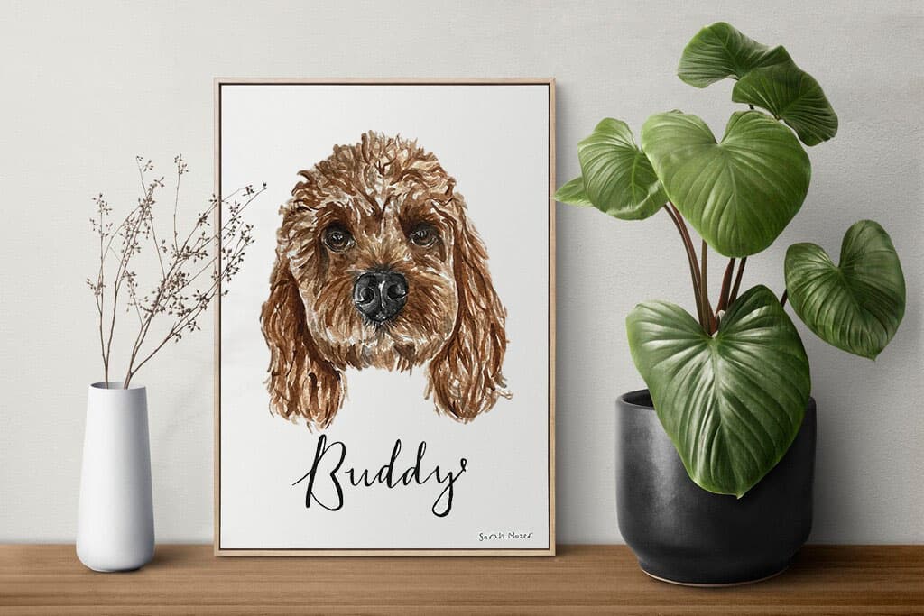 Framed brown dog portrait mockup on a shelf with a plant and vase